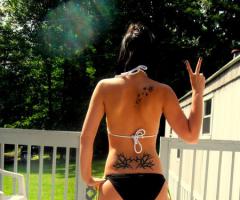 Woman bikini back tattoo