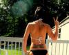 Woman bikini back tattoo
