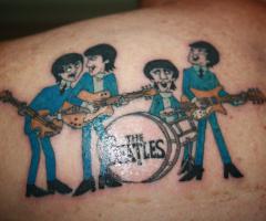 The Beatles tattoo on shoulder
