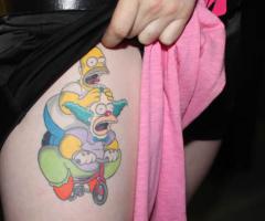 Homero y Krusty en la mini bicicleta de payaso