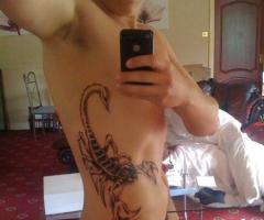 Scorpion tattoo on ribs