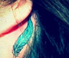 Demi Lovato feather tattoo
