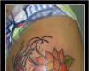 Tatuagem borboleta e flor de lótus no braço