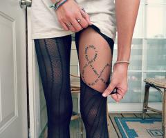 Sexy lettering tattoo on leg