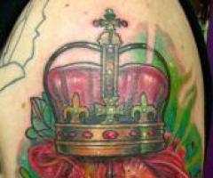 Lion and crown tattoo