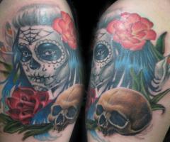 Diseño de tatuaje de La Catria en el brazo