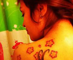 Swallow and cherry blossom tattoo