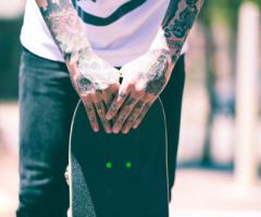 Skateboarding guy tattooed