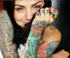 Beautiful girl arm and hand tattoos