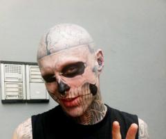 Zombie boy head and arm tattoos