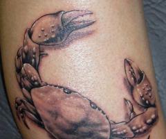 Crab tattoo by cancer sign