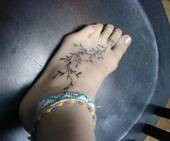 Tender vine design for your foot, if you wish to flaunt a sleek tattoo