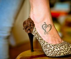 Show your love for soulful music with a music heart tattoo
