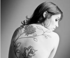 Beautiful back turned into a canvas filled with tender flower art work