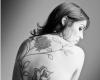 Beautiful back turned into a canvas filled with tender flower art work