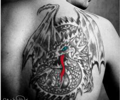 Black dragon with wings and colored eye and tongue