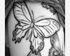 A big butterfly in dark shade inked on ribcage