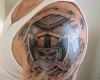 Biomechanical armor Oakland Raider tattoo looks as if will just pop out