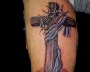 Wooden Cross with thorny vines across it reminding of the great sacrifice by the Savior