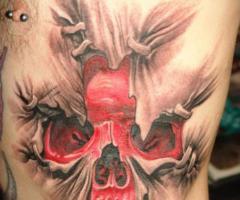 It's a massive 3D style red skull ripping out from his side back