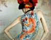 Stunning colors on this full back koi with sparkling waves in the background