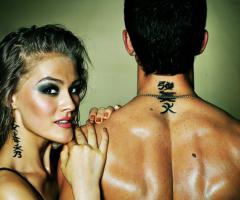 Kanji script inked on their necks giving an exclusive definition to their connection