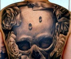 An epitome of striking full back piece of a realistic skull