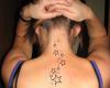 Swirling star outlines for a stylish tattoo on back neck