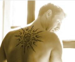 Great looking design of a big tribal sun for upper back