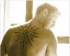 Great looking design of a big tribal sun for upper back