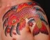 Glossy koi placed like Yin Yang, with lotus flowers