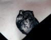 Black, ash-like anatomical heart tattoo inked on chest