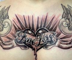 A bold chest piece of a heart with wings to impress your true love