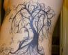 Gorgeously intense ribcage piece that displays a lonely tree of an autumn