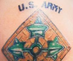 The Army insignia with the motto to defend and protect