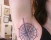 Girl with under arm compass rose tattoo