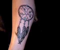 dream catcher on my left inner calf