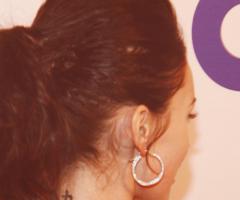 Megan Fox's neck theres a small black symbol for strength