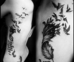 Feather and lettering tattoo