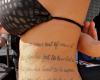 Poem tattoo on waist