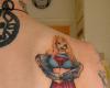 Supergirl back tattoo design