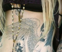 Kat Von D Rocking angel tattoo