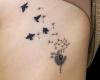 Tatuagem de flores e passaros