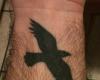 Tatuaje de cuervo volando