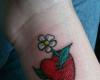 Heart flowers tattoo