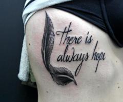 20 Adorable Feather Tattoos