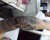Tatuaje media manga maori