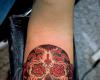 Sugar skull tattoo on forearm