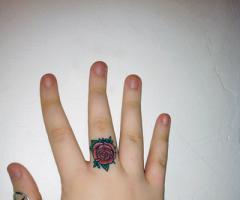 Ring of small rose tattoo
