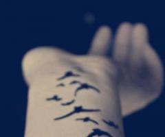 Bird arm tattoo design
